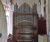 The entrance to Hatley St George church, Hatley St George, Cambridgeshire / 13th September 2018. Facing you are the 1878 Bevington organ and 19th century font to the right. Above the organ are some of the St. George family shields which are a feature of the church.