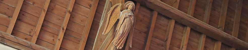 Roof angel in Hatley St George church, Cambridgeshire. There are eight in all decorating the supports of the church's hammerbeam roof.