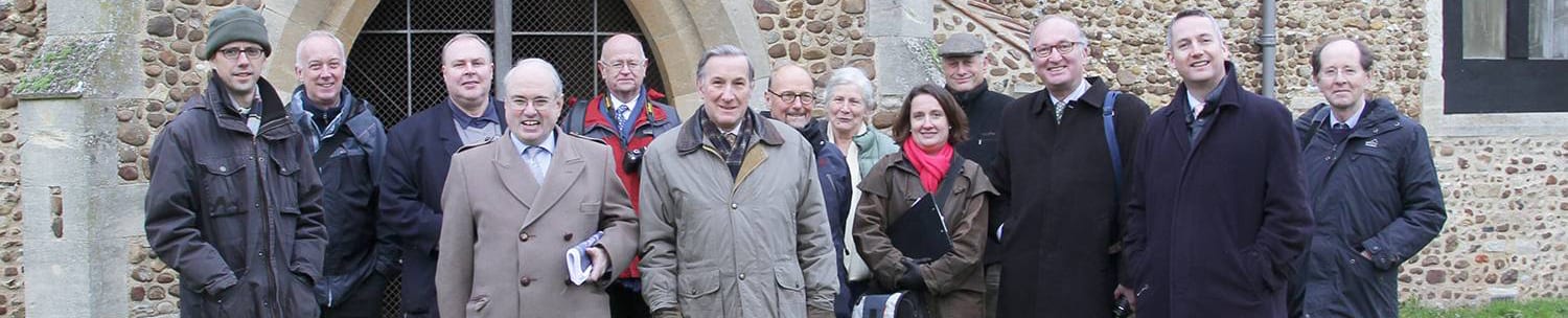 St Denis' church East Hatley, Cambridgeshire – the first visit by trustees of the Friends of Friendless Churches on 26th November 2013. 1. Revd Steven Rothwell, Rector of Gamlingay and Hatley at the time of the FoFC visit. 2. David Bevan, Conservation and Design Manager, South Cambs District Council at the time of the FoFC visit. 3. Councillor Richard Smith, Trustee, Friends of Friendless Churches. 4. Roger Evans MA, Chairman, Friends of Friendless Churches. 5. Howard Pool, Trustee, Friends of Friendless Churches. 6. Peter Scott, Treasurer, Friends of Friendless Churches. 7. Richard Halsey MBE, Executive Committee, Friends of Friendless Churches. 8. Joyce Denby, East Hatley resident. 9. Stephanie Norris, Project Architect, Purcell UK. 10. Councillor Nick Wright, Planning Committee member, South Cambridgeshire District Council. 11. Matthew Saunders MBE, Director at the time of the FoFC visit, Friends of Friendless Churches. 12. Councillor Sebastian Kindersley, County Councillor for Gamlingay (which includes Hatley) and East Hatley resident. 13. Sir Paul Britton, Trustee, Friends of Friendless Churches. Photo: Peter Mann.
