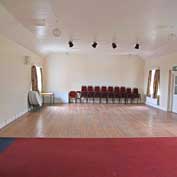 Hatley Village Hall – interior of the spacious hall, which has good acoustics. The floor is part carpet, part wood, making it ideal for meetings, talks and discos.