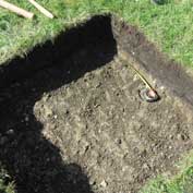 Neat, square test pit at the East Hatley, Cambridgeshire, dig on 5th September 2015.