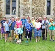 Happy volunteers at the St Denis' church East Hatley, Cambridgeshire, churchyard tidy-up on 4th August 2019.