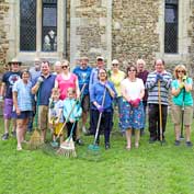 Happy volunteers at the St Denis' church East Hatley, Cambridgeshire, churchyard tidy-up on 4th August 2019.