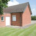 The wheelchair entrance to Hatley village hall, in Hatley St George, Cambridgeshire – a ramp is kept in the space behind the doors. The hall is available for hire any day or evening of the week. Contact the Parish Clerk on 01767 650 596.