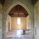 The chancel and nave of St Denis' church, East Hatley. In spring 2022, the Friends of Friendless Churches removed the very crumbly 150 year old plaster in the nave , replastered it with the correct lime putty mix, then lime washed it with a half tone blend of the pigments from the original 'cream' and 'conch' colours. St Denis' is now every day from 8.30 am to dusk. Photo: Peter Mann / Buzz Associates.