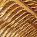 The Baltic pine roof timbers inside St Denis' church, East Hatley, installed by William Butterfield during his restoration of the church in 1874 – he reused the original mediaeval timbers as floor supports in the nave.  Photo: Peter Mann / Buzz Associates.