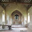 The south wall in the nave and (at the far end) the reredos of St Denis' church, East Hatley in April 2021. In 2022 the walls in the nave were replastered and the reredos restored. St Denis' is now every day from 8.30 am to dusk. Photo: Peter Mann / Buzz Associates.