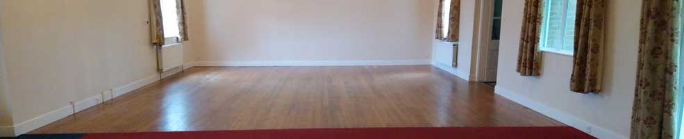 Hatley village hall – interior of the spacious hall, which has good acoustics. The floor is part carpet, part wood, making it ideal for meetings, talks and discos.