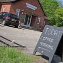 Hatley Coffee Morning sign.  The Coffee Mornings are held on the first Tuesday of every month in Hatley village hall, Hatley St George, Cambridgeshire, from 10.00 am to 1.00 pm.